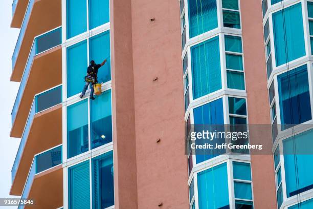Florida, Miami Beach, Portofino Tower with Window Washer.