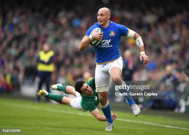 Sergio Parisse of Italy escapes the tackle of Joey Carbery of Ireland during the NatWest Six Nations match between Ireland and Italy at Aviva Stadium...