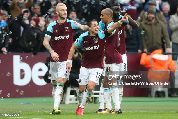 Javier Hernandez of West Ham celebrates scoring their 1st goal with Marko Arnautovic of West Ham, Joao Mario of West Ham and Cheikhou Kouyate of West...