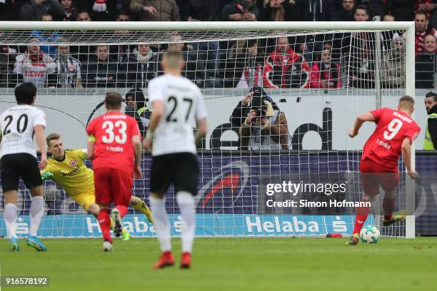 Simon Terodde of Koeln scores a penalty goal to make it 1:1 during the Bundesliga match between Eintracht Frankfurt and 1. FC Koeln at...