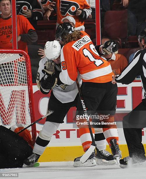 Kris Letang of the Pittsburgh Penguins and Scott Hartnell of the Philadelphia Flyers mix it late in the third period at the Wachovia Center on...