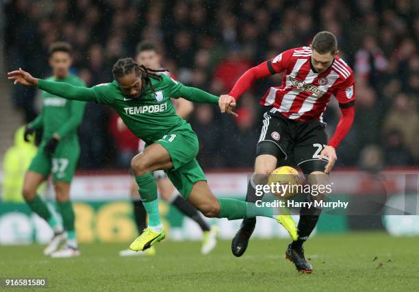 Henrik Dalsgaard of Brentford tackles Daniel Johnson of Preston North End during the Sky Bet Championship match between Brentford and Preston North...