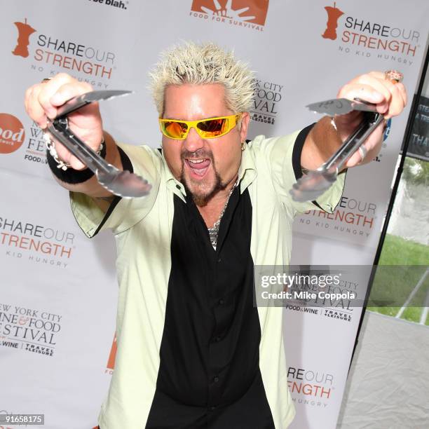 Personality and Chef Guy Fieri attends a grill-off for the 2009 Food Network NYC Wine & Food Festival at the Norwegian Cruise Line Welcome Center at...