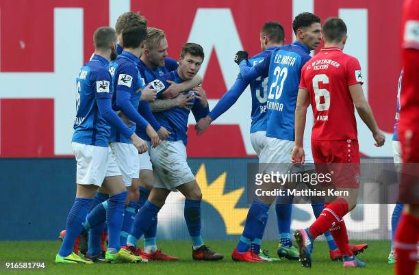 Vladimir Rankovic of Rostock jubilates with team mates after scoring the third goal during the 3. Liga match between F.C. Hansa Rostock and FC...