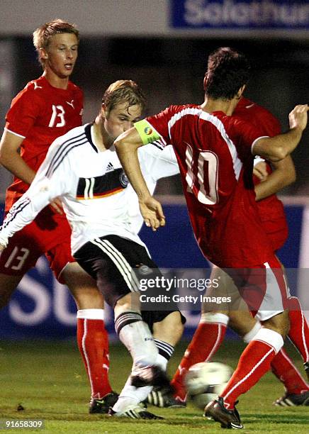 Maximilian Beister of Germany scores the second goal against Switzerlands Raphel Koch and Daniel Unal of Switzerland during the U20 international...