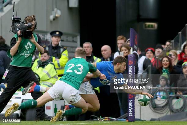 Italy's full-back Matteo Minozzi scores their third try during the Six Nations international rugby union match between Ireland and Italy at the Aviva...