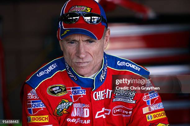 Mark Martin, driver of the Kellogg's/CARQUEST Chevrolet, sits in the garage during practice for the NASCAR Sprint Cup Series Pepsi 500 at Auto Club...