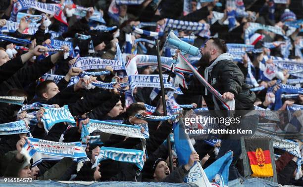 Supporters of Rostock celebrate their team during the 3. Liga match between F.C. Hansa Rostock and FC Wuerzburger Kickers at Ostseestadion on...