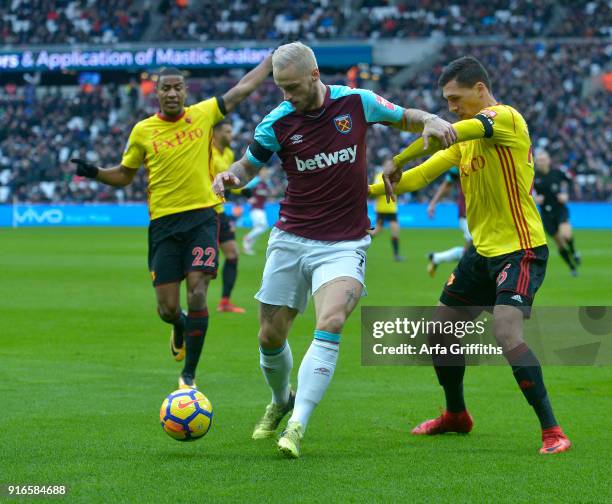 Marko Arnautovic of West Ham United in action with Marvin Zeegelaar and Jose Holebas of Watford during the Premier League match between West Ham...