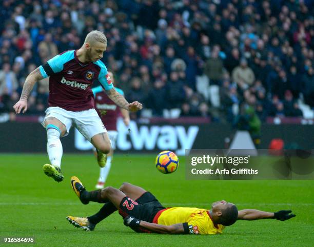 Marko Arnautovic of West Ham United in action with Marvin Zeegelaar of Watford during the Premier League match between West Ham United and Watford at...