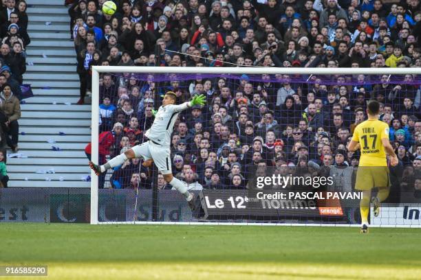 Paris Saint-Germain's French goalkeeper Alphonse Areola jumps to make a save during the French L1 football match between Toulouse and Paris...