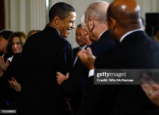 President Barack Obama greets members of the crowd following an event in the East Room of the White House in support of a new Consumer Financial...