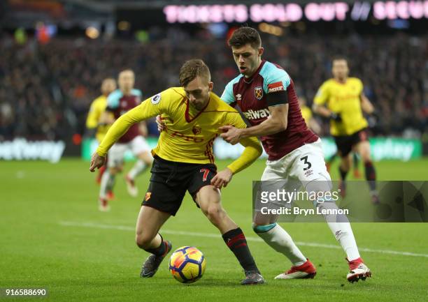 Gerard Deulofeu of Watford and Aaron Cresswell of West Ham United battle for the ball during the Premier League match between West Ham United and...