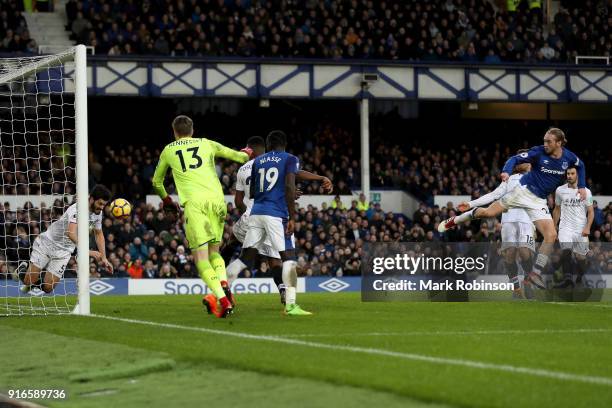 Tom Davies of Everton shoots and scores his side's third goal during the Premier League match between Everton and Crystal Palace at Goodison Park on...