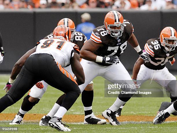 Offensive lineman John St. Clair of the Cleveland Browns prepares to block defensive lineman Robert Geathers of the Cincinnati Bengals during a game...