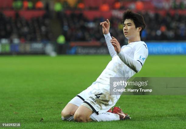 Ki Sung-Yueng of Swansea City celebrates after scoring his sides first goal during the Premier League match between Swansea City and Burnley at...