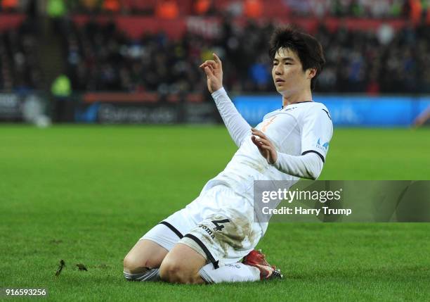 Ki Sung-Yueng of Swansea City celebrates after scoring his sides first goal during the Premier League match between Swansea City and Burnley at...