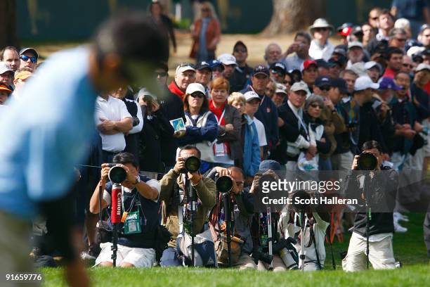 Ryo Ishikawa of the International Team is photographed as he lines up a putt on the first green during the Day Two Fourball Matches of The Presidents...