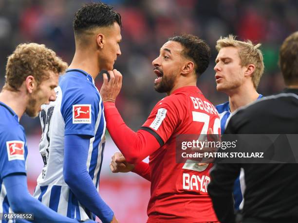 Leverkusen's German midfielder Karim Bellarabi discuss with Berlin's German forward Davie Selke during the German first division Bundesliga football...