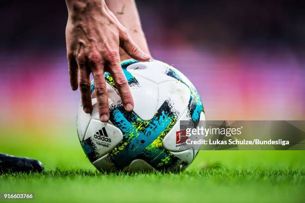 Player touches the official ball during the Bundesliga match between Bayer 04 Leverkusen and Hertha BSC at BayArena on February 10, 2018 in...