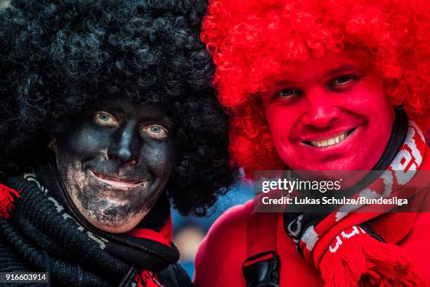 Fans of Leverkusen wear costumes and stay together prior to the Bundesliga match between Bayer 04 Leverkusen and Hertha BSC at BayArena on February...