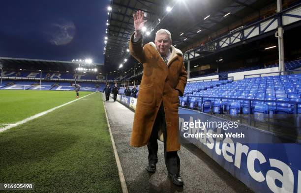 Commentator John Motson waves after the Premier League match between Everton and Crystal Palace at Goodison Park on February 10, 2018 in Liverpool,...