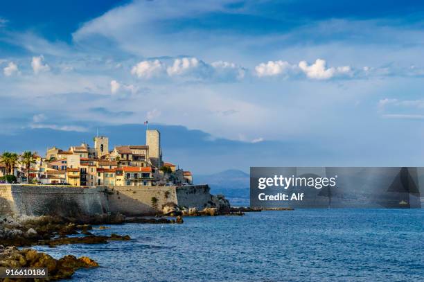 panoramic of antibes from the peninsula of le cap., french riviera, france - antibes stock-fotos und bilder