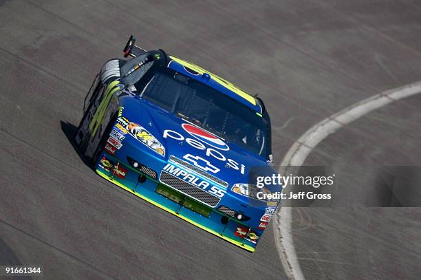 Jeff Gordon drives the DuPont/Pepsi Chevrolet during practice for the NASCAR Sprint Cup Series Pepsi 500 at Auto Club Speedway on October 9, 2009 in...