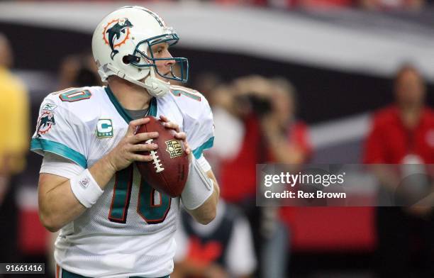 Chad Pennington of the Miami Dolphins drops back to pass against the Atlanta Falcons at Georgia Dome on September 13, 2008 in Atlanta, Georgia. The...