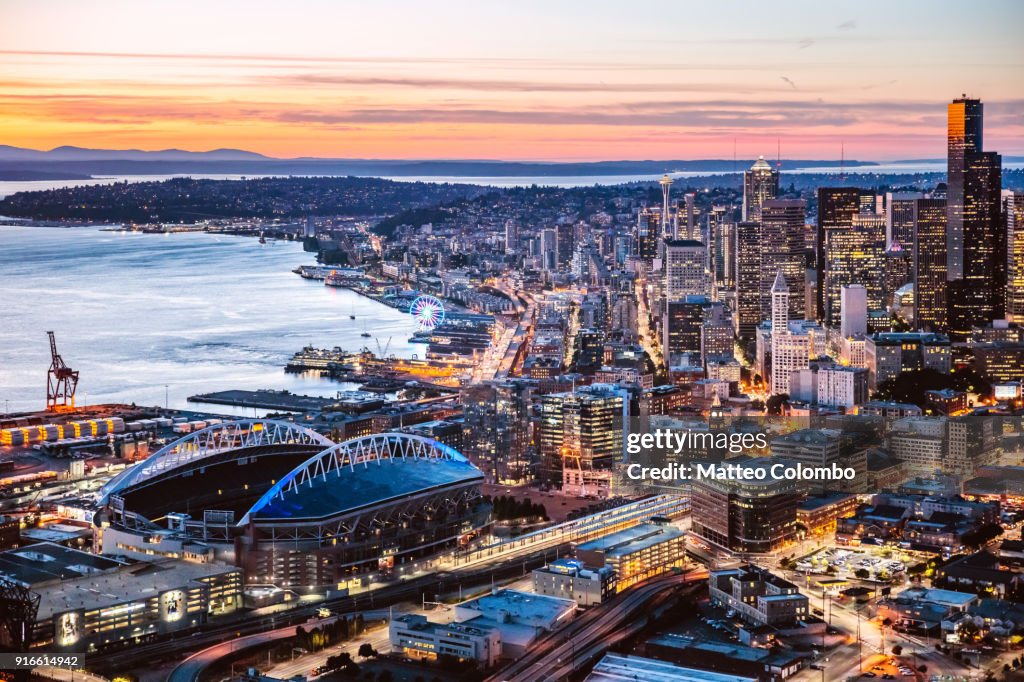 Aerial view of Seattle downtown and harbor at dusk, USA