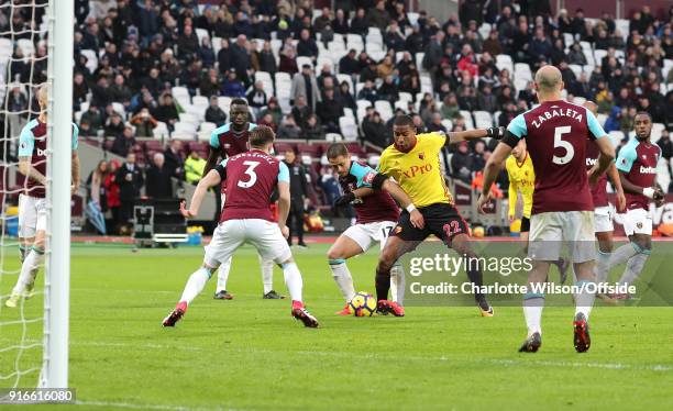 Javier Hernandez of West Ham and Marvin Zeegelaar of Watford battle for the ball in the box during the Premier League match between West Ham United...
