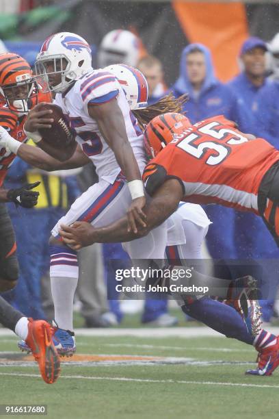 LeSean McCoy of the Buffalo Bills runs the football up field against Vontaze Burfict of the Cincinnati Bengals during their game at Paul Brown...