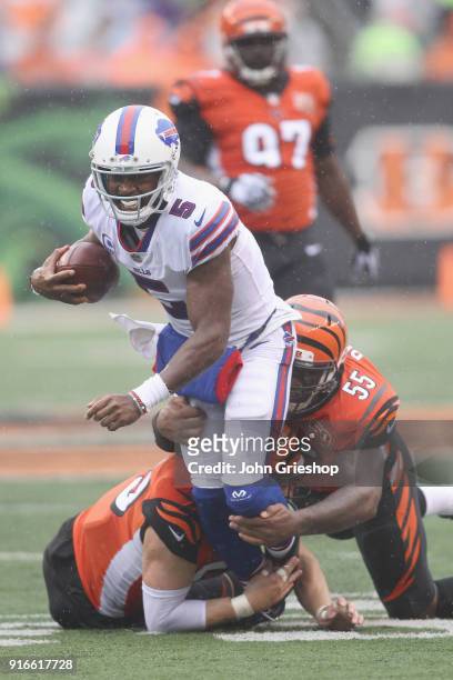 Tyrod Taylor of the Buffalo Bills runs the football up field against Vontaze Burfict of the Cincinnati Bengals during their game at Paul Brown...