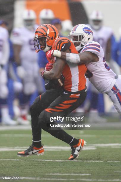 Tre'Davious White of the Buffalo Bills makes the tackle on A.J. Green of the Cincinnati Bengals during their game at Paul Brown Stadium on October 8,...