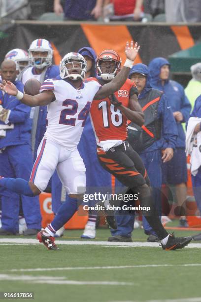 Leonard Johnson of the Buffalo Bills battles for the football with A.J. Green of the Cincinnati Bengals during their game at Paul Brown Stadium on...