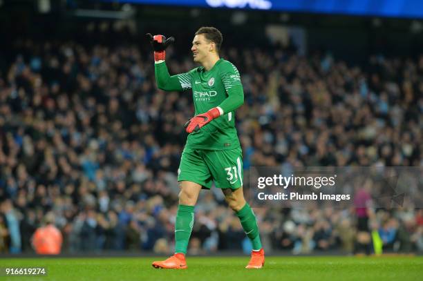 Ederson Moraes of Manchester City celebrates after Raheem Sterling of Manchester City scores to make it 1-0 during the Premier League match between...