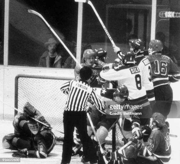 Norway and the USA mix it up in a free-for-all battle near the Norway goal. Tore Falk Nilsen pulls American Mike Eruzione off his feet, while Dave...