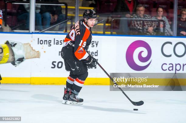 David Quenneville of the Medicine Hat Tigers skates with the puck against the Kelowna Rockets at Prospera Place on January 30, 2018 in Kelowna,...