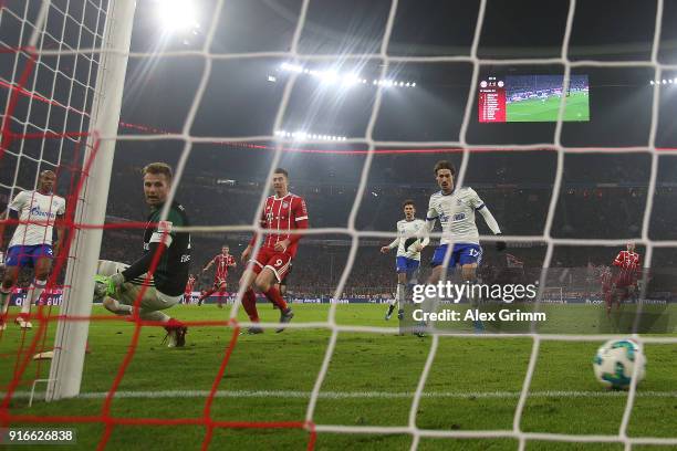 Thomas Mueller of Bayern Muenchen scores a goal past goalkeeper Ralf Faehrmann of Schalke to make it 2:1 during the Bundesliga match between FC...