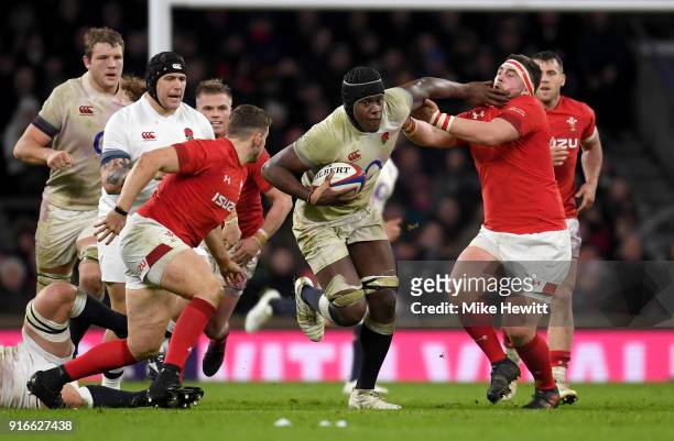 Maro Itoje of England pushes away Wyn Jones of Wales during the NatWest Six Nations round two match between England and Wales at Twickenham Stadium...