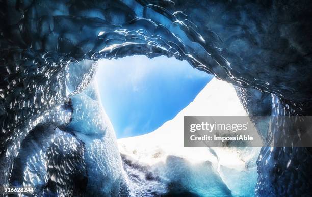 iceland ice cave vatnajokull hole and clear blue sky - impossiable fotografías e imágenes de stock