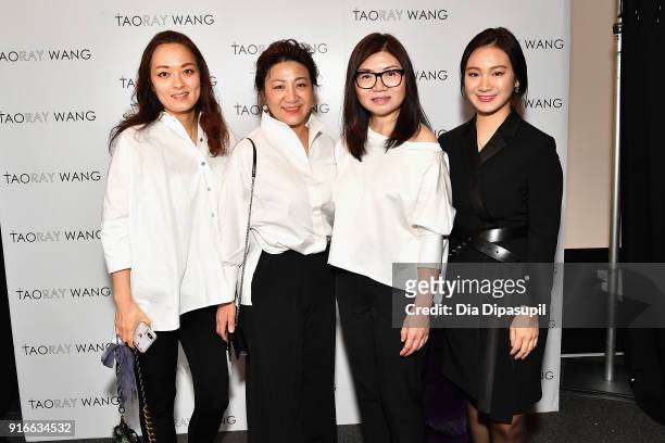 Designer Taoray Wang poses backstage with guests at the Taoray Wang fashion show during New York Week: The Shows at Gallery II at Spring Studios on...