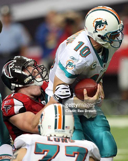 Kroy Biermann of the Atlanta Falcons stops Chad Pennington of the Miami Dolphins for a loss at Georgia Dome on September 13, 2008 in Atlanta,...