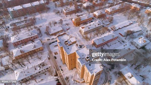 the aerial panoramic view on the winter city covered by the snow in the bright cold sunny day - ukraine city stock pictures, royalty-free photos & images