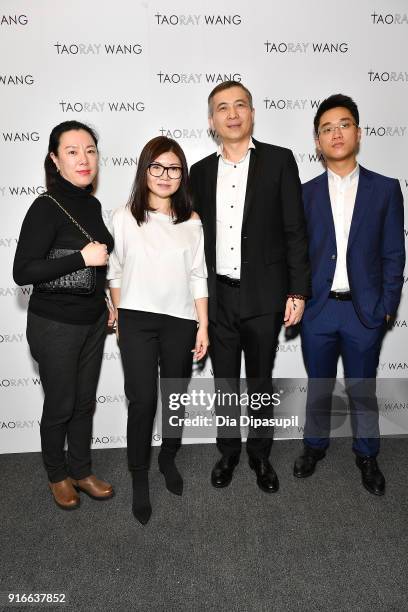 Designer Taoray Wang poses backstage with guests at the Taoray Wang fashion show during New York Week: The Shows at Gallery II at Spring Studios on...