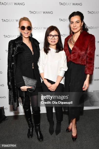 Designer Taoray Wang poses backstage with guests at the Taoray Wang fashion show during New York Week: The Shows at Gallery II at Spring Studios on...