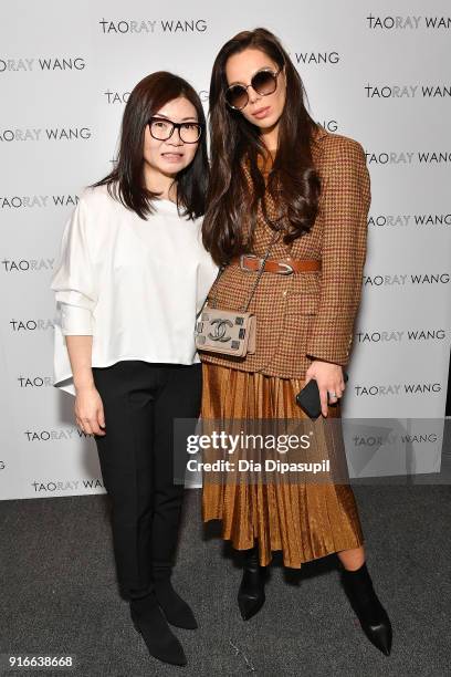 Designer Taoray Wang poses backstage with guests at the Taoray Wang fashion show during New York Week: The Shows at Gallery II at Spring Studios on...