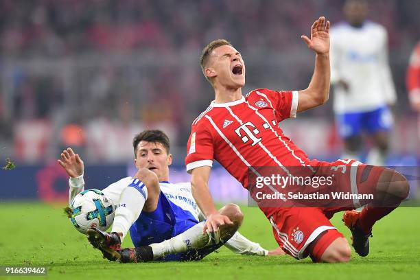 Joshua Kimmich of Bayern Muenchen is fouled by Alessandro Schoepf of Schalke during the Bundesliga match between FC Bayern Muenchen and FC Schalke 04...