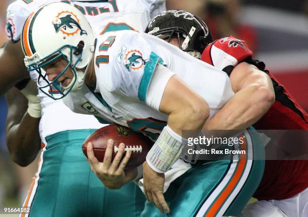 Kroy Biermann of the Atlanta Falcons stops Chad Pennington of the Miami Dolphins for a loss at Georgia Dome on September 13, 2008 in Atlanta,...
