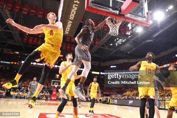 Dererk Pardon of the Northwestern Wildcats drives to the basket over Kevin Huerter of the Maryland Terrapins during a college basketball gam at the...